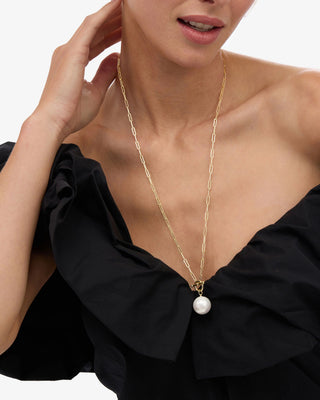 Melinda Maria XL Life's A Ball Pearl Pendant Necklace. Model is wearing the necklace.