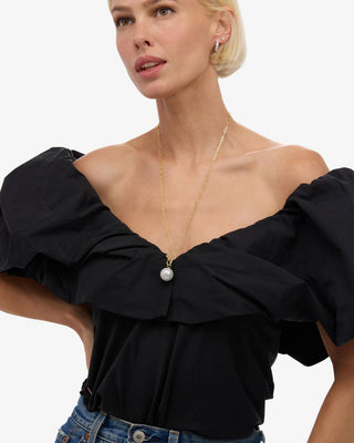 Melinda Maria XL Life's A Ball Pearl Pendant Necklace. Model is wearing the necklace. 