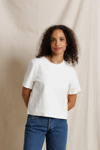 Perfect White Tee Atlas Crewneck Heavy Jersey Cotton Tee White. Model is posing in the product and image is shot on white background. 