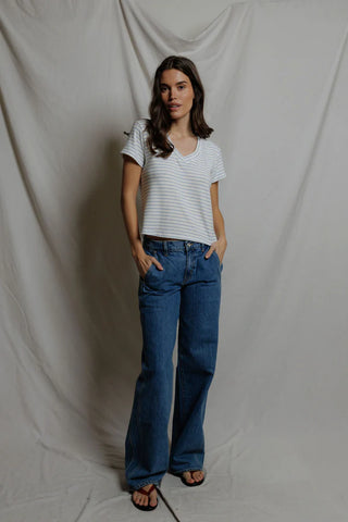 Perfect White Tee Elliot Brushed Sweater Strip V Neck Tee Pacific Stripe. Model is posing on a white background in the product. 