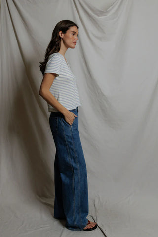 Perfect White Tee Elliot Brushed Sweater Strip V Neck Tee Pacific Stripe. Model is angled to the side and is wearing the product. 