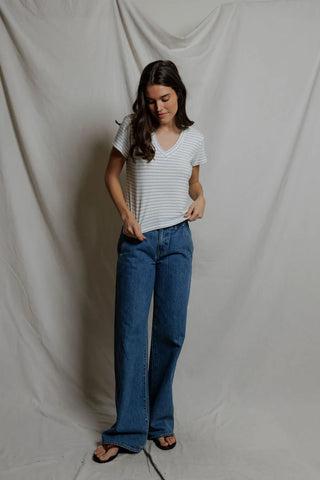 Perfect White Tee Elliot Brushed Sweater Strip V Neck Tee Pacific Stripe. Model is looking down while wearing the product. 