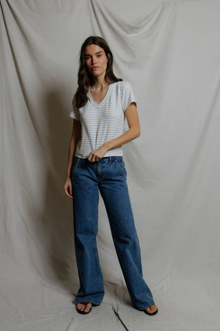 Perfect White Tee Elliot Brushed Sweater Strip V Neck Tee Pacific Stripe. Model is wearing the top and looking at the camera. 