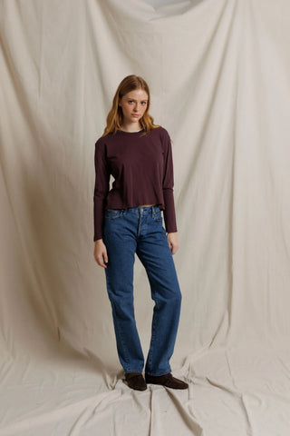 Perfect White Tee Harley Long Sleeve Crispy Cotton Boxy Tee Cherry Lacquer. Model is posing in front of white background.