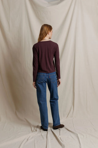 Perfect White Tee Harley Long Sleeve Crispy Cotton Boxy Tee Cherry Lacquer. Model is posing in front of white background.