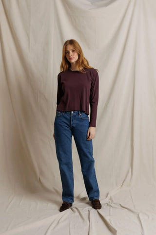 Perfect White Tee Harley Long Sleeve Crispy Cotton Boxy Tee Cherry Lacquer. Model is posing in front of white background.
