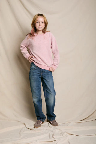 Perfect White Tee Mini Ziggy Vintage Pink Reverse Fleece Crew Neck Sweatshirt. Model is wearing the product and this is shot on a white background. 