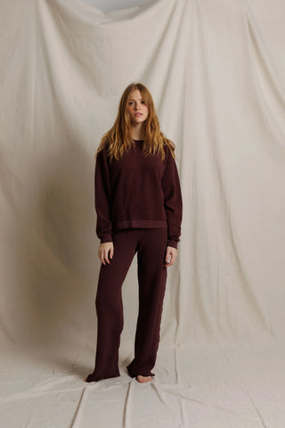 Perfect White Tee Oversized Ziggy Reverse Fleece Crew Neck Sweatshirt Cherry Lacquer. Model is posing in front of white background. 