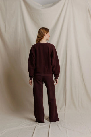 Perfect White Tee Oversized Ziggy Reverse Fleece Crew Neck Sweatshirt Cherry Lacquer. Model is posing in front of white background. 