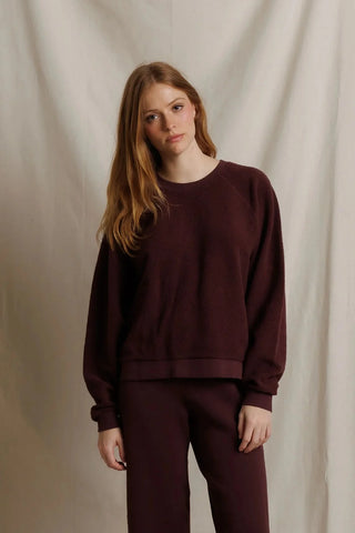 Perfect White Tee Oversized Ziggy Reverse Fleece Crew Neck Sweatshirt Cherry Lacquer. Model is posing in front of white background. 