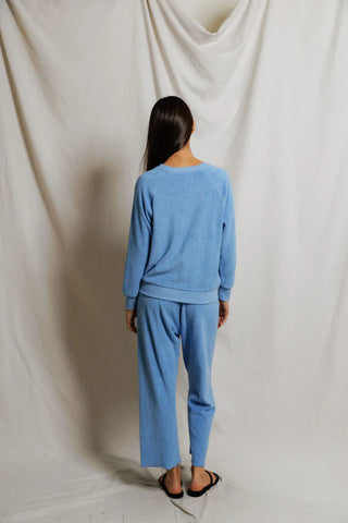 Perfect White Tee Saylor Loop Terry Sweatshirt Pacific Blue. Model is turned away wearing the product. 