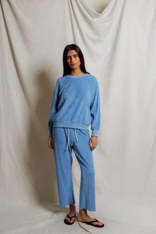 Perfect White Tee Saylor Loop Terry Sweatshirt Pacific Blue. Model is posing wearing the product. 
