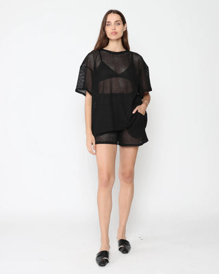 Ripley Rader Black Fishnet Lounge Shorts. Model is wearing product posing on a white background. 