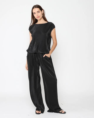 Ripley Rader Black Micropleat Lounge Pant. Model is posing on a white background. 
