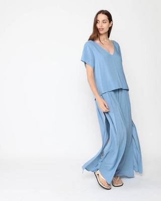Ripley Rader Chambray Linen Everyday V Neck. Model is posing on a white background in the product. 