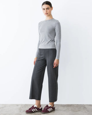 Ripley Rader Charcoal Ponte Knit Straight Leg Pant-Cropped. Model is posing in the product in front of the white background. 