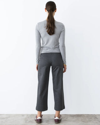 Ripley Rader Charcoal Ponte Knit Straight Leg Pant-Cropped. Model is posing in the product in front of the white background. 