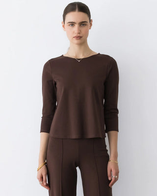 Ripley Rader Chocolate Ponte Knit 3/4 Sleeve Top. Model is wearing the top and is posing in front of a white background. 