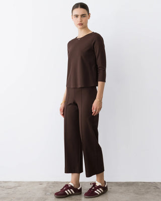 Ripley Rader Chocolate Ponte Knit 3/4 Sleeve Top. Model is wearing product and posing in front of a white background. 