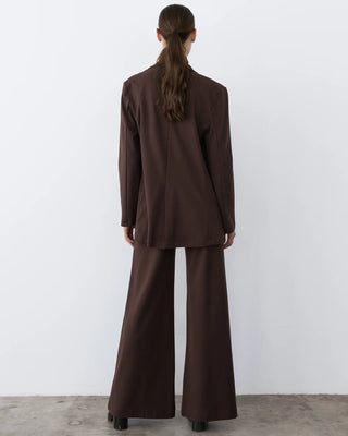 Ripley Rader Chocolate Ponte Knit Oversized Blazer. Model is turned around and posing in front of a white background.