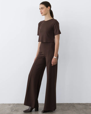 Ripley Rader Chocolate Ponte Knit Wide Leg Pant-Long. Model is wearing the product and is posing in front of a white background.