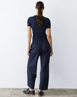 Ripley Rader Navy Ponte Knit Barrel Pant. Model is wearing the product and image is shot on white background. 