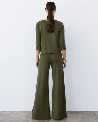 Ripley Rader Olive Ponte Knit 3/4 Sleeve Top. Model is turned wearing product. 