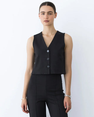 Ripley Rader Ponte Knit Vest Black. Model is posing in front of white background. 