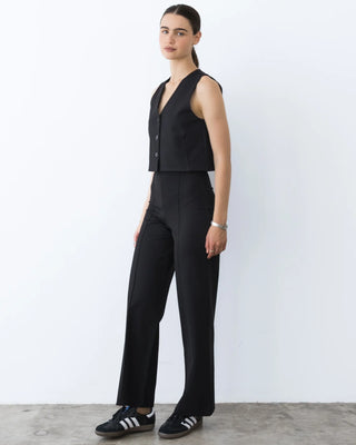 Ripley Rader Ponte Knit Vest Black. Model is posing in front of white background. 