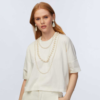 Lele sadoughi headband, Lele sadoughi jewelry, Lele Sadoughi accessories, Lele Sadoughi Ivory Short- Sleeve Pearl Strand Tee, Lele Sadoughi shirts, Lele Sadoughi clothes, Lele Sadoughi pearl shirt, pearl shirt, ivory shirts, white shirts