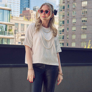 Lele sadoughi headband, Lele sadoughi jewelry, Lele Sadoughi accessories, Lele Sadoughi Ivory Short- Sleeve Pearl Strand Tee, Lele Sadoughi shirts, Lele Sadoughi clothes, Lele Sadoughi pearl shirt, pearl shirt, ivory shirts, white shirts