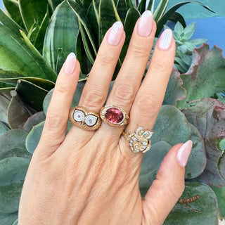 three stories owl flip ring on model hand