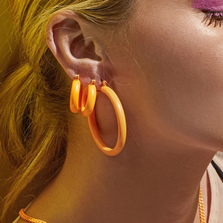 Luv AJ Baby Amalfi Tube Hoops Neon Orange "gold tube hoops" "luv aj martina hoops" "luv aj pave hoops" "luv aj heart earrings" "luv aj capri wire hoops" "amalfi earrings" "luv aj baby amalfi hoops" "luv aj amalfi hoops"